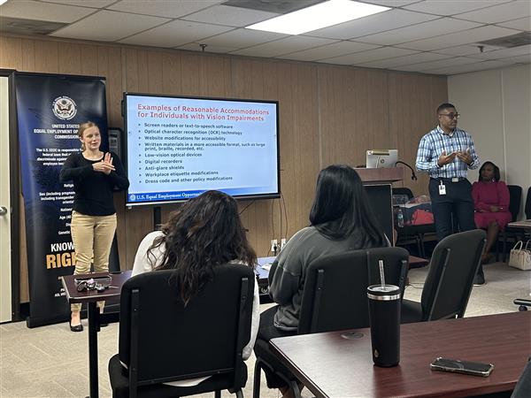 AIDB Birmingham Staff Interpreter Lydia Leno interprets for a workshop on Employment Discrimination with Federal investigator Cortise Miles.